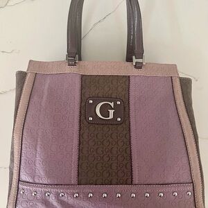 Large Guess handbag with silver hardware and studded front detailing.